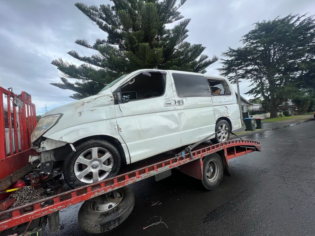 Crashed white van on the back of a tow truck in Whakatāne
