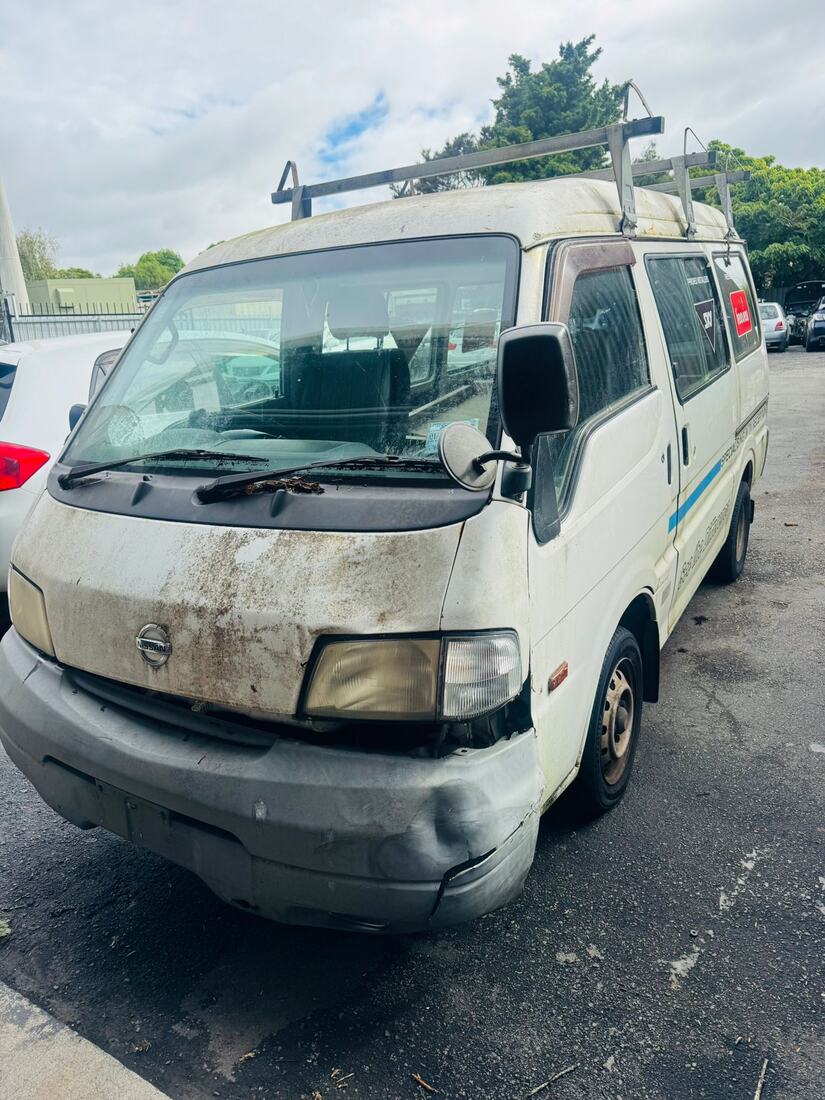 Well-used Nissan Vanette van with roof racks before pickup